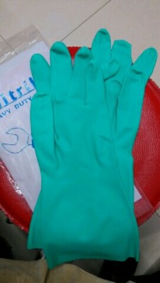 Industrial green nitrile gloves.