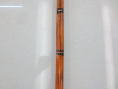 A walking stick with A flat head and small handle