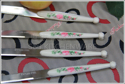 The new boxed 12PCS plastic clamp handle printing fruit knife and fork