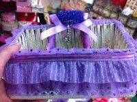 Purple doll, tissue box