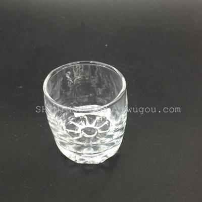 At the end of a round dot point at the bottom of glass bead glass cup a cup of liquor