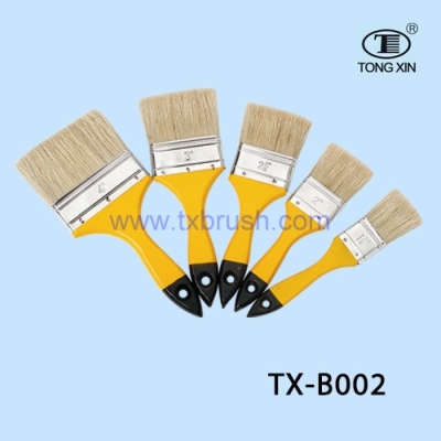 Yellow wood handle paint brush.