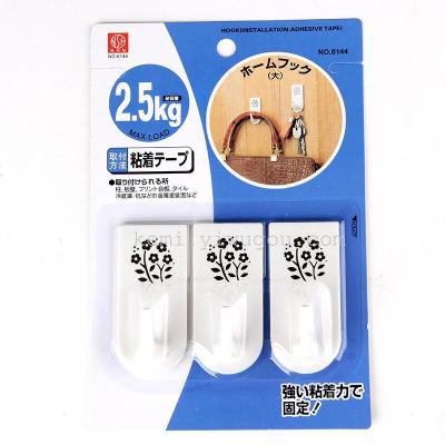 Japan NHS. 6144. The Small print plastic adhesive hooks. The three into
