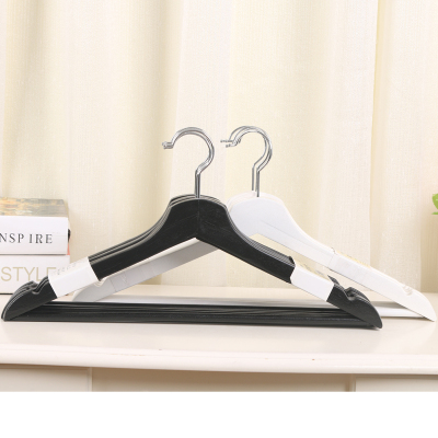 A black and white wood hanger for adult hangers hc-8037.
