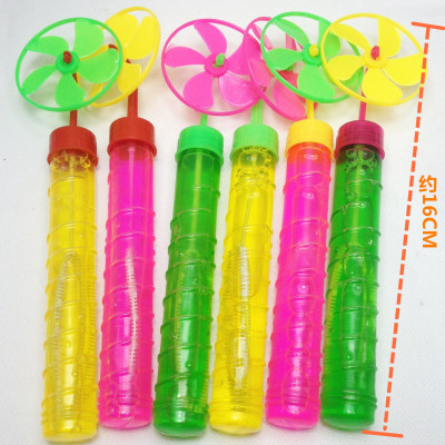 Children's toy bubble water with a circle of small windmill bubble stick colored bubble water
