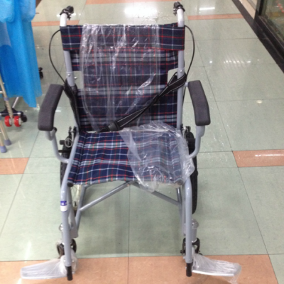 The old man with a wheelchair standard can fold the manual wheelchair.