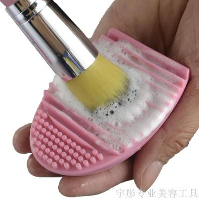 Cleaning device for portable multifunctional cosmetic brush with egg washing device