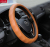 Breathable and anti - skid whole leather car leather steering wheel set with four seasons.