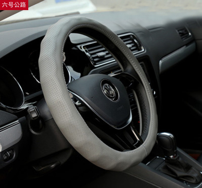 Breathable and anti - skid whole leather car leather steering wheel set with four seasons.
