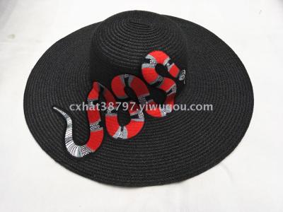The daming beauty snake decked out with a hat to protect the sun from outside.