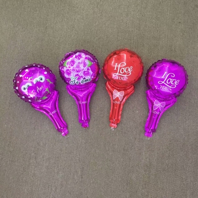 There are a variety of hand - held balloons.