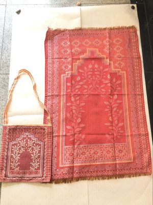 The Muslim and a prayer mat