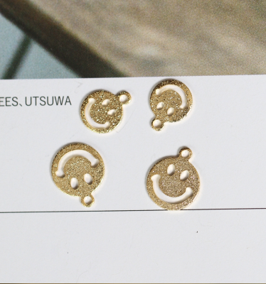 Popular selling smiley face grinding copper piece diy hollowed-out smiley face.