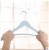 The new clothes rack creative imitation wood plastic pants rack clothing store household towel anti-slip clothes hanger.
