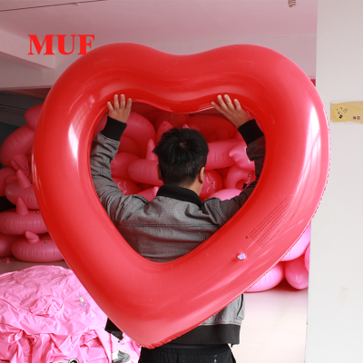 Manufacturer direct selling ins sell inflatable heart swimming circle inflatable heart ring adult water circle float.