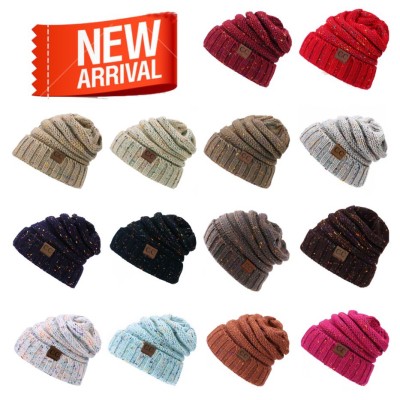 Foreign trade new European and American point yarn cc-label knit cap, men and women general outdoor hat manufacturers spot supply.