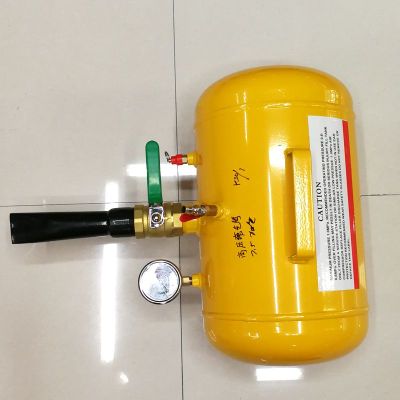 The large car's vacuum tire exploder is filled with high pressure filling cylinder.