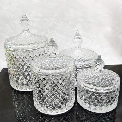 Transparent  glass sugar bowl of several size candy jars  glass cups.