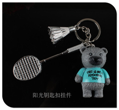 Teddy bear violent bear badminton sport version of the personality key chain hanging.