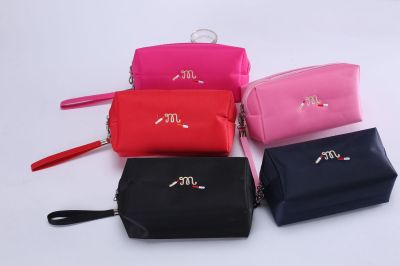 The new fashion collection in 2018 is a package tour of MINI cosmetic bags with pure color printing letters.