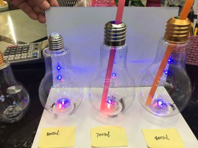 Creative plastic light bulb bottle with light emitting juice beverage bottle