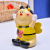 Cartoon color ceramic honeybee small bee piggy bank children cute change can table top with a piggy bank.