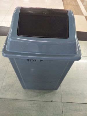 The outdoor trash can pushes the trash can over the trash can