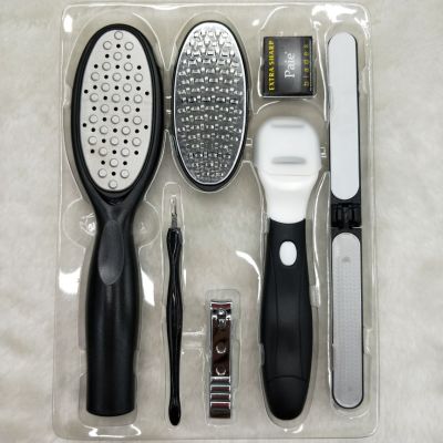Manicure kit foot file, exfoliate nail file, exfoliate nail clippers, and a razor blade