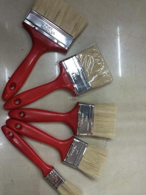 Red plastic handle white brush