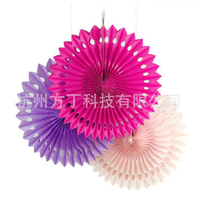The birthday party decoration is a hollow paper fan flower