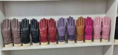 Manufacturer sells new lady's warm gloves. Touch screen non-slip gloves.