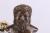 An antique brass bust of genghis khan