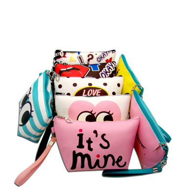Taobao hot - shot emoji makeup bag cross - grain handbag waterproof handbag mingtai source manufacturers