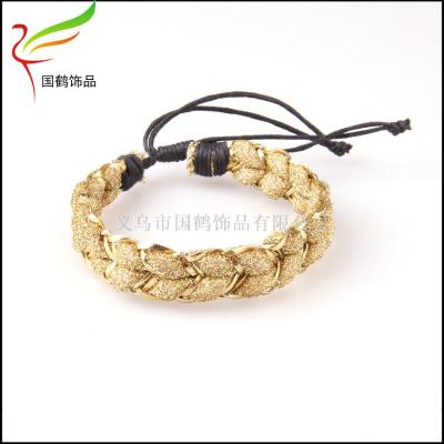 Hand-knitted gold and silver thread bracelet