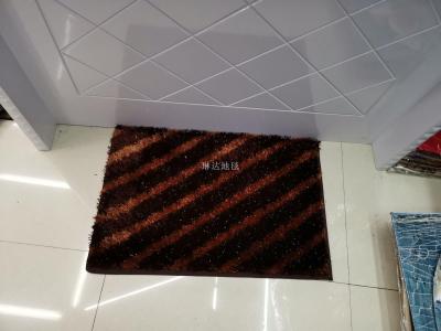 The mat is on the floor of the bathroom mat