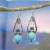Rongyu Wish Hot Sale New Inlaid Turquoise Drop-Shaped Flower Earrings European and American Retro Plated 925 Silver Earrings