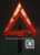 A warning triangle, reflecting triangle