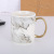 A Nordic marble mug with gold-plated handles is A gift mug for daily use