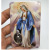 The prayer card reveals The holy mark of The Catholic holy object Jesus Christ, The virgin Mary