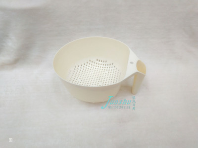 Kitchen appliances with a circular plastic water filter basin for washing vegetables and fruits