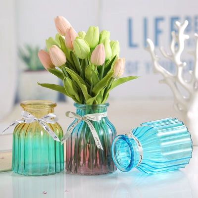 Small round glass vases with vertical bars. Put vases in colorful vases