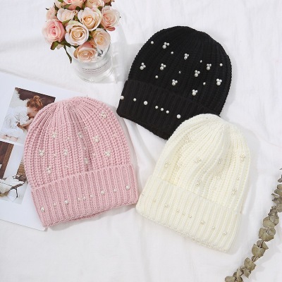 Manufacturers wholesale of autumn and winter is suing pure color turtleneck wool hats fashion dome pearl warm knit hats