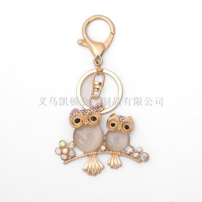 Manufacturers customized hot - selling opal owl key chain creative diamond flower pendant gift small gifts