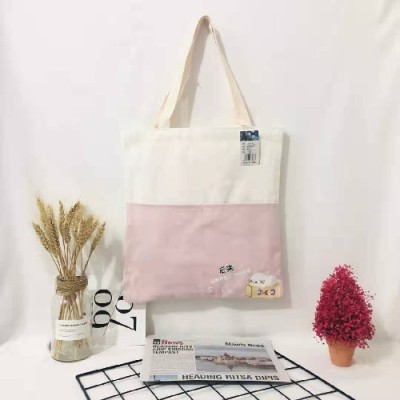 A Double pocket canvas bag with one shoulder