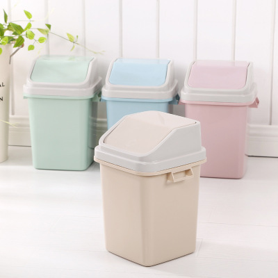 Plastic Garbage can household toilet sitting upturned paper basket the toilet has a lid on the kitchen Garbage can