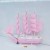 The girl is Mediterranean style pink model sailboat decoration wooden boat plain decoration