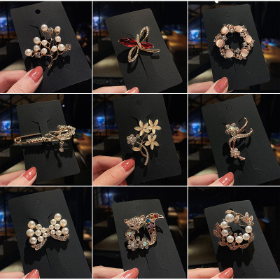 Korean retro high-grade brooch hand water drill pearl brooch foreign trade European and American fashion animal flower silk buckle