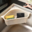 A storage basket for kitchen articles with suction cup type kitchen shelf