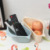 A storage basket for kitchen articles with suction cup type kitchen shelf