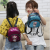 Manufacturers direct selling children's fashion fabric shiny color-changing backpack children's snacks can be made parent-child style